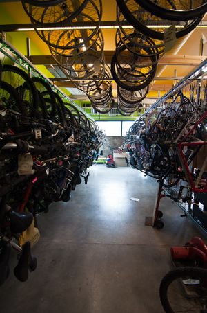 Bikes and wheels in track rack bike hanger